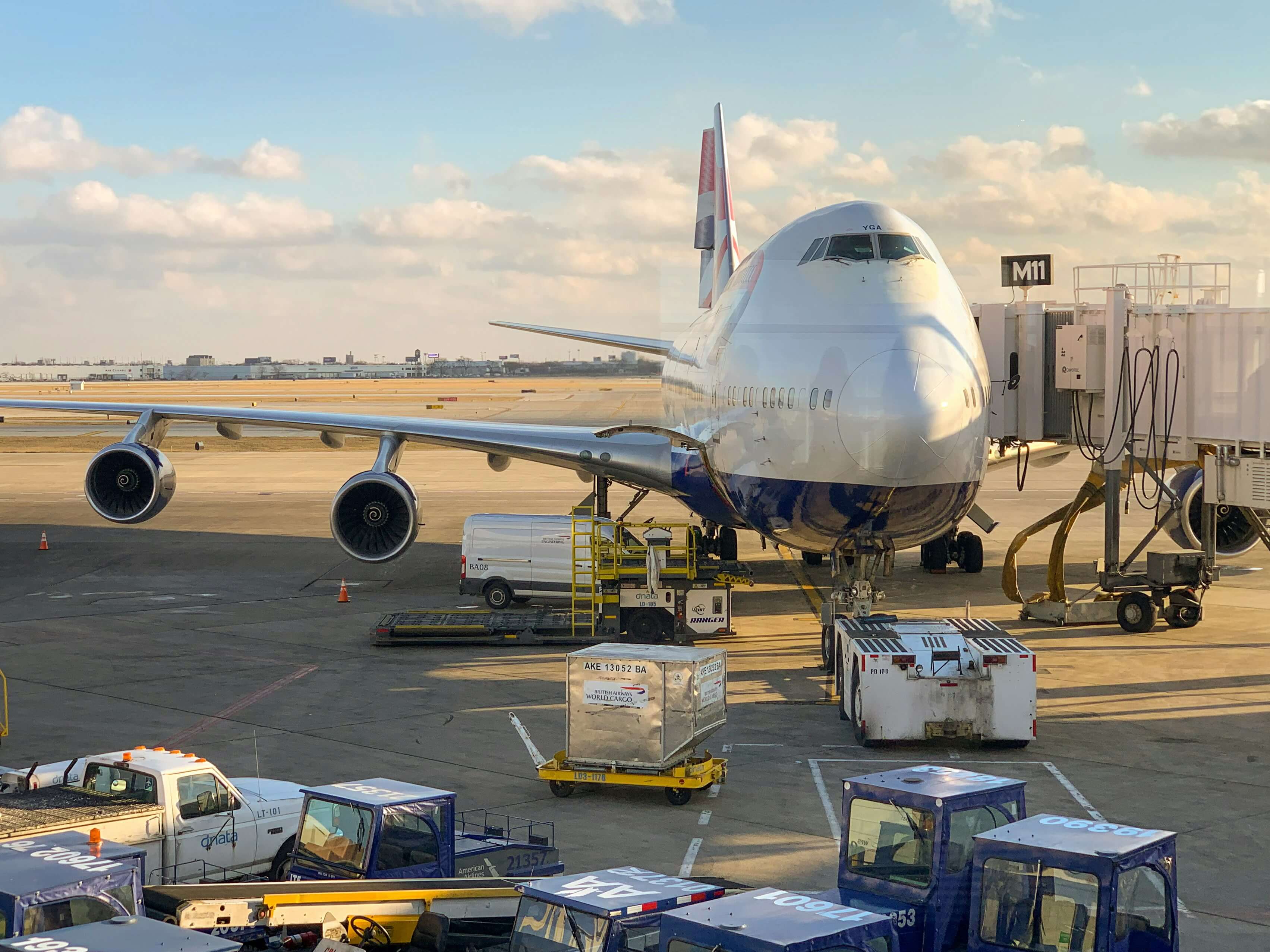 Cargo plane being loaded on airport tarmac